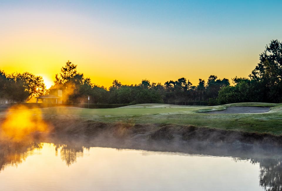 Course greens over the lake 